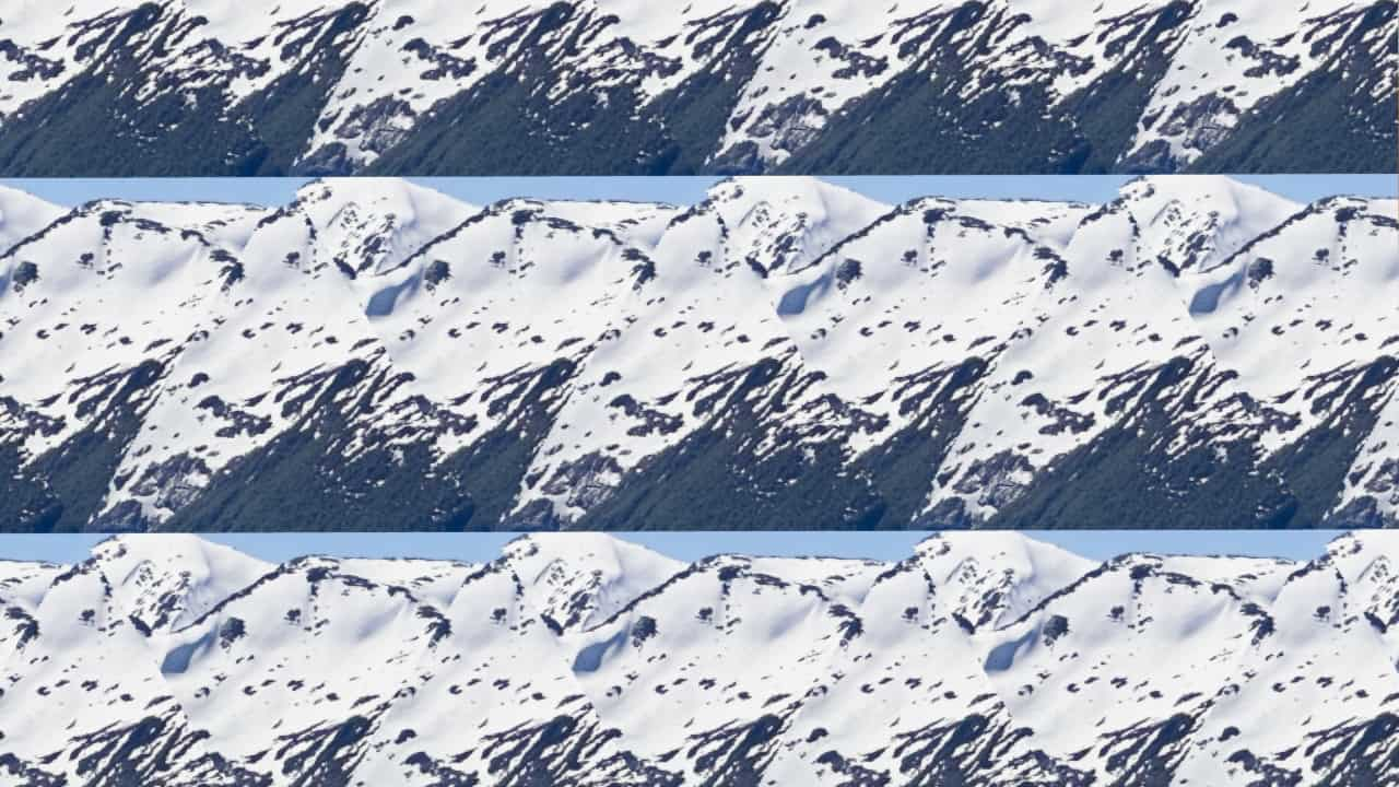 Image of mountain with the center triangle copied in trianglular tiling