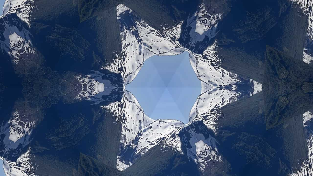 Triangle kaleidoscope tile of an image of a mountain